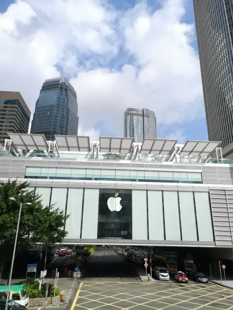Glass Apple Store cube above the streets of Central
